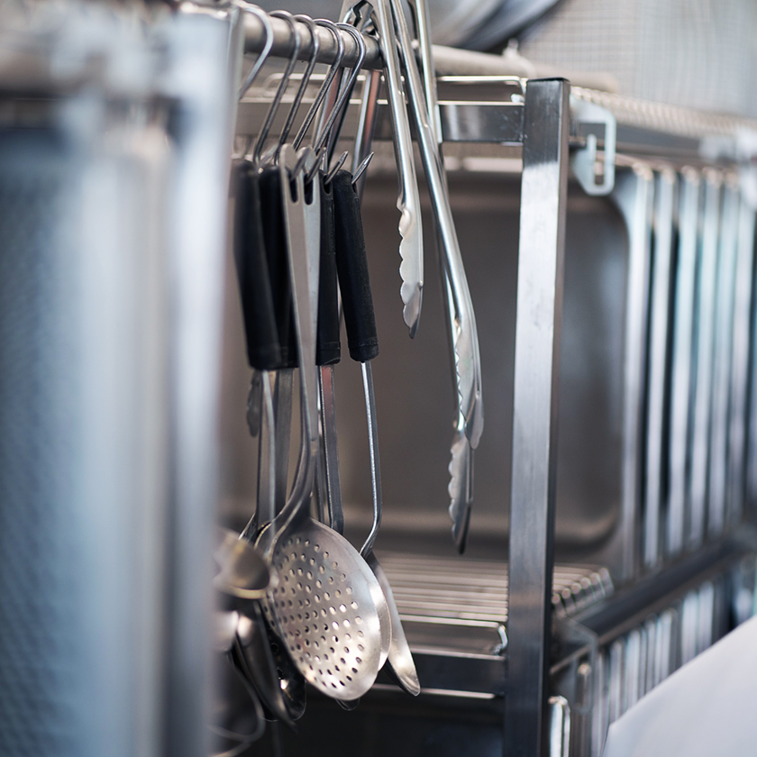 Utensils hanging in rack